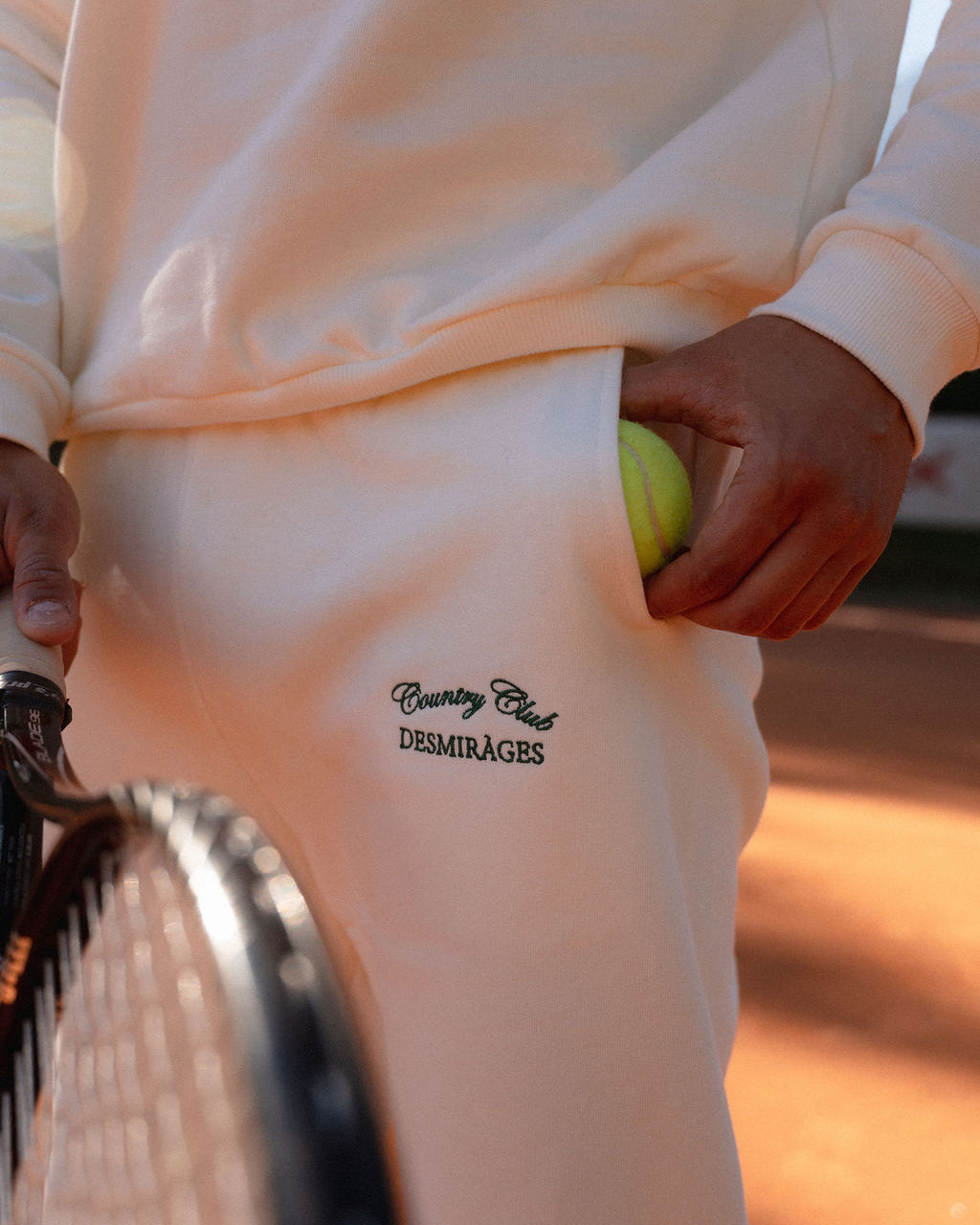 e pocket and a racket alongside.
