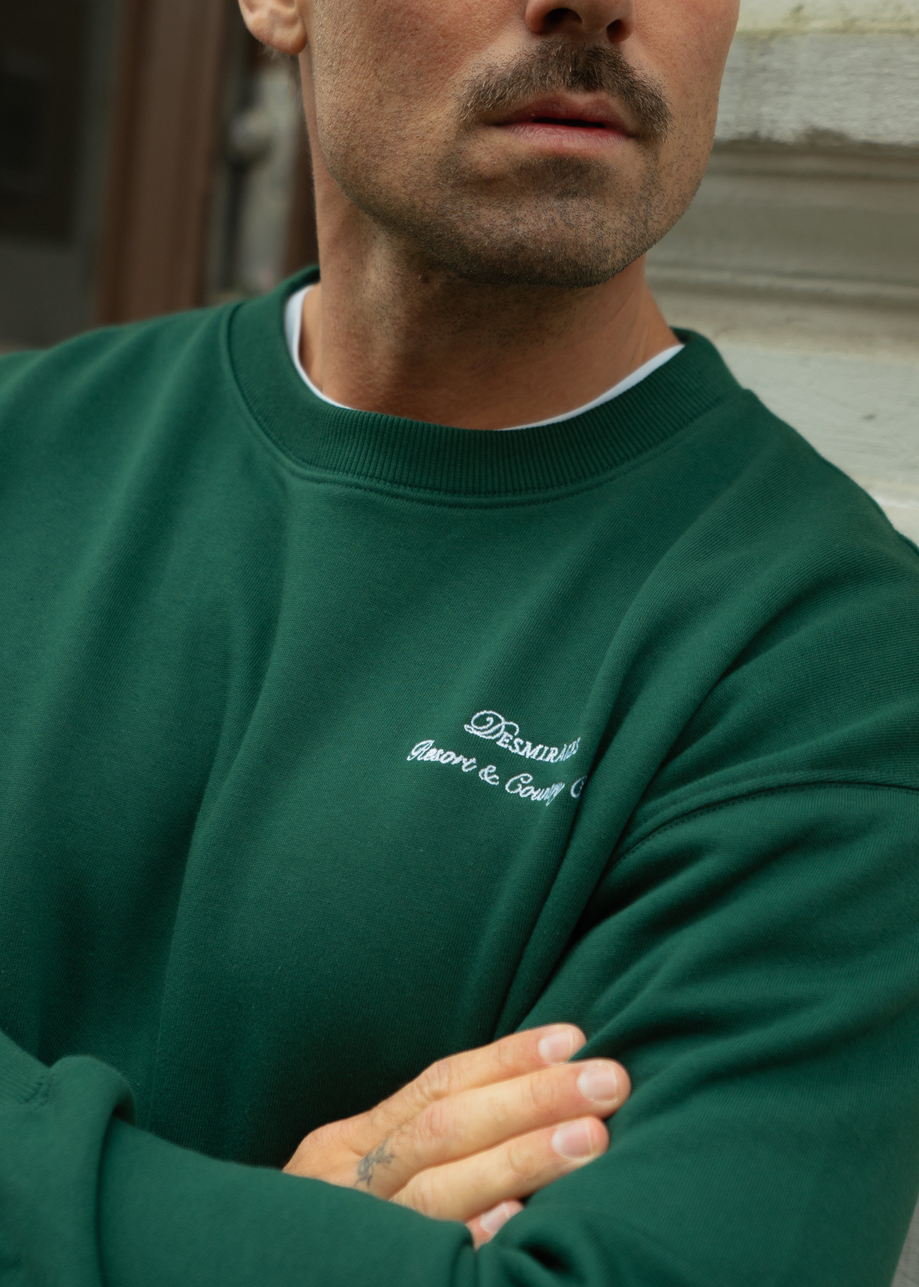 Sweater with embroidered logo