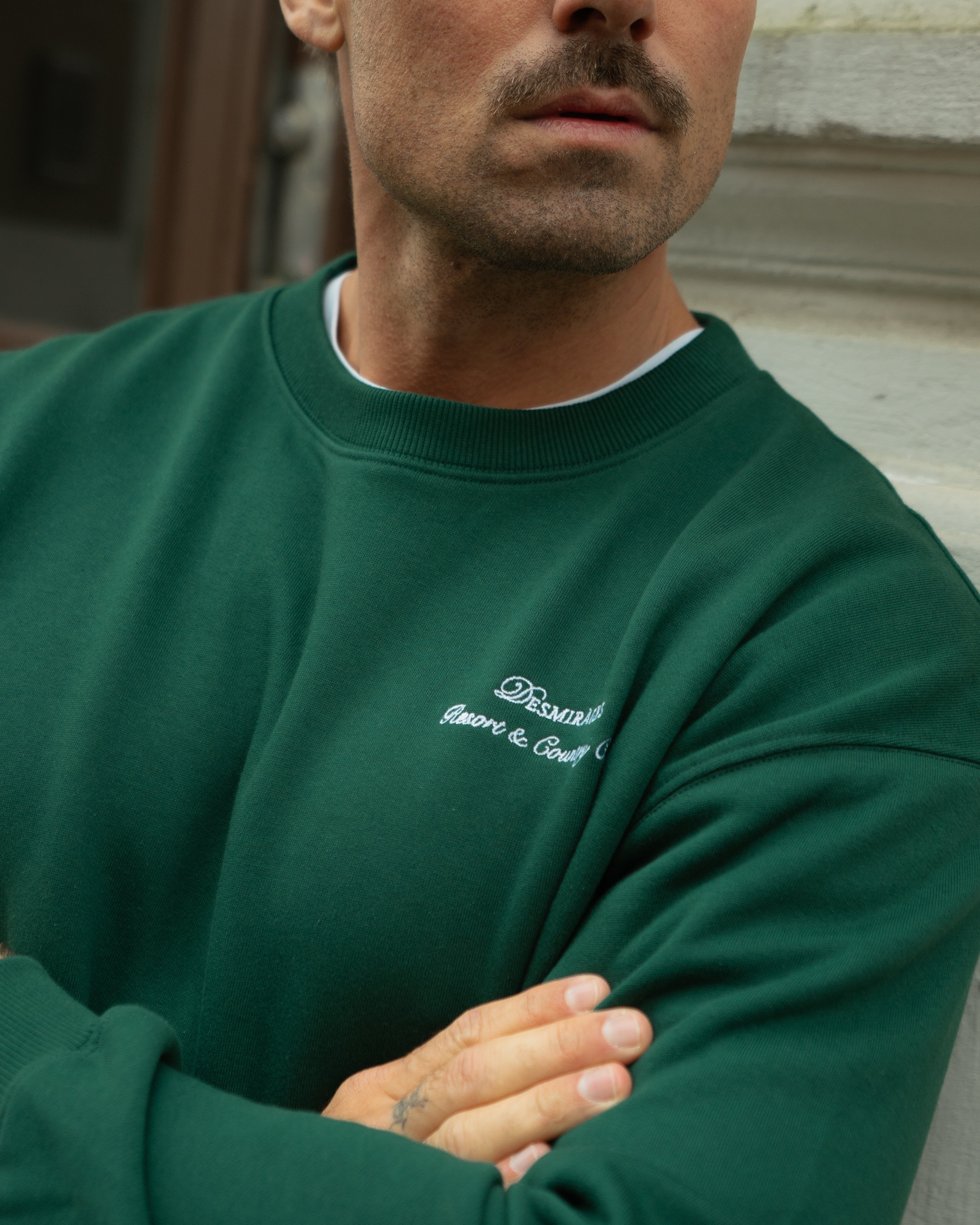 Sweater with embroidered logo