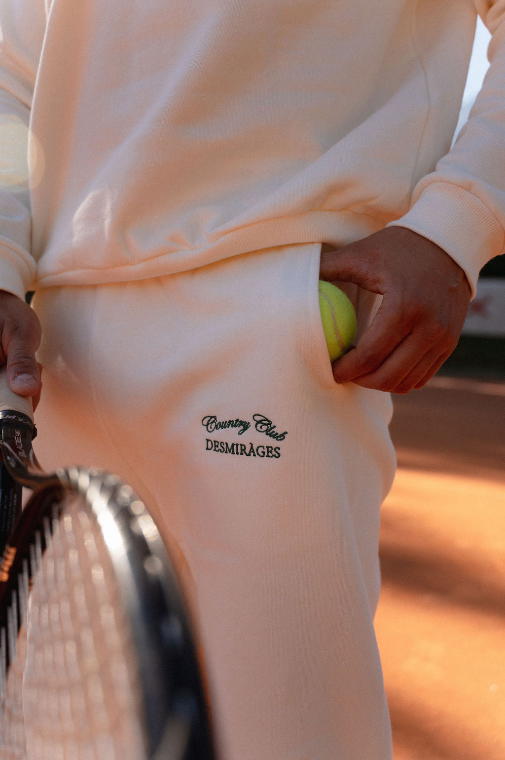 e pocket and a racket alongside.